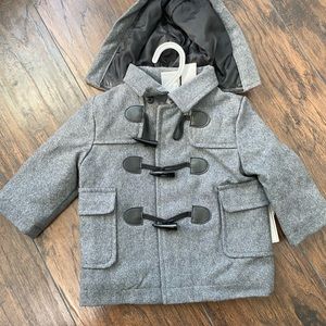 Never worn, with tags, removable hood.